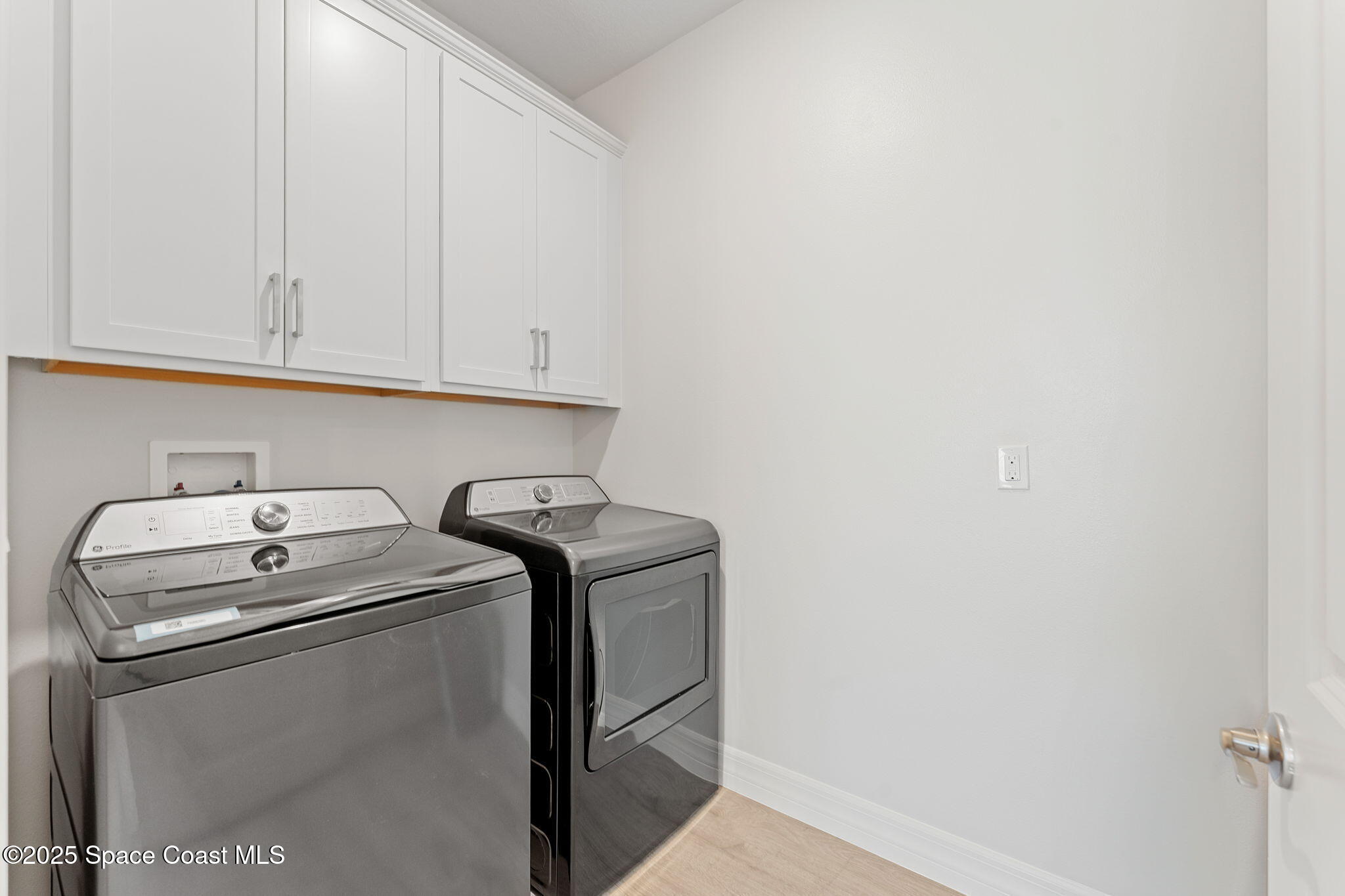 225 1st Street Cocoa, FL 32922 - Photo 57 of 64 a utility room with dryer and washer