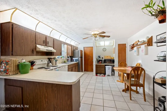 a kitchen with cabinets a sink and appliances