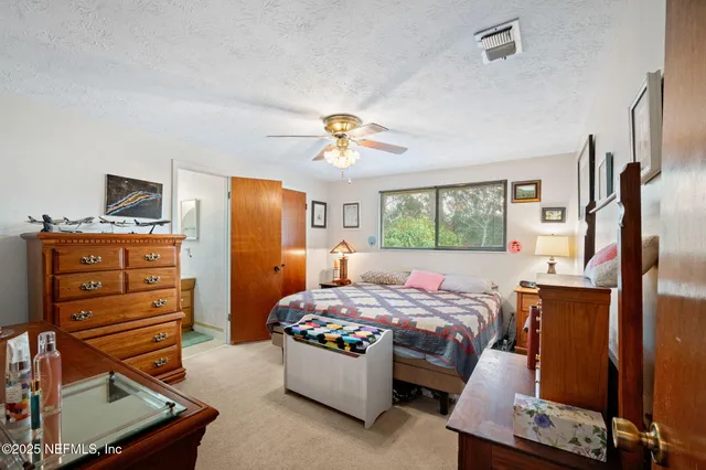 a bedroom with a bed and furniture