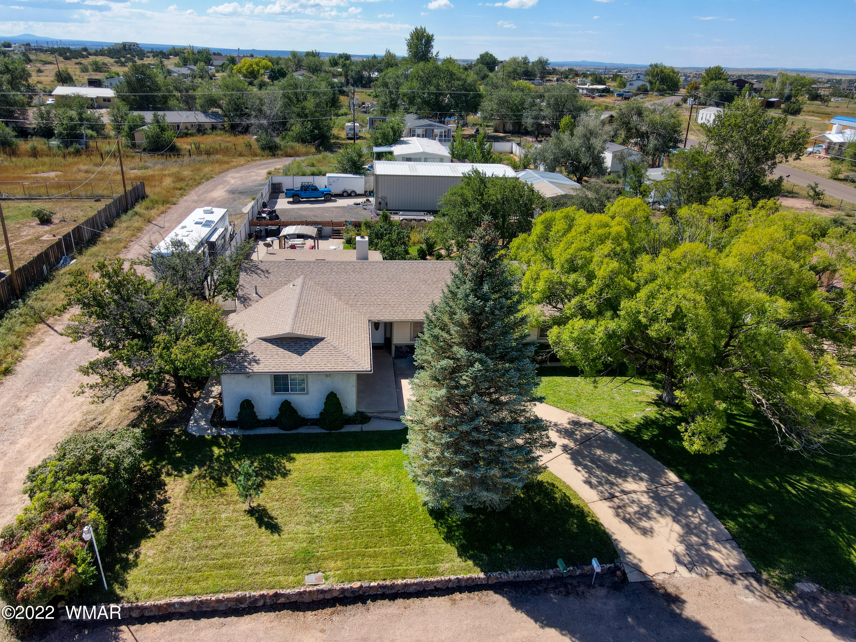 501 West 7th S Street Snowflake, AZ 85937 - Photo 2 of 33 an aerial view of a house with a garden and lake view