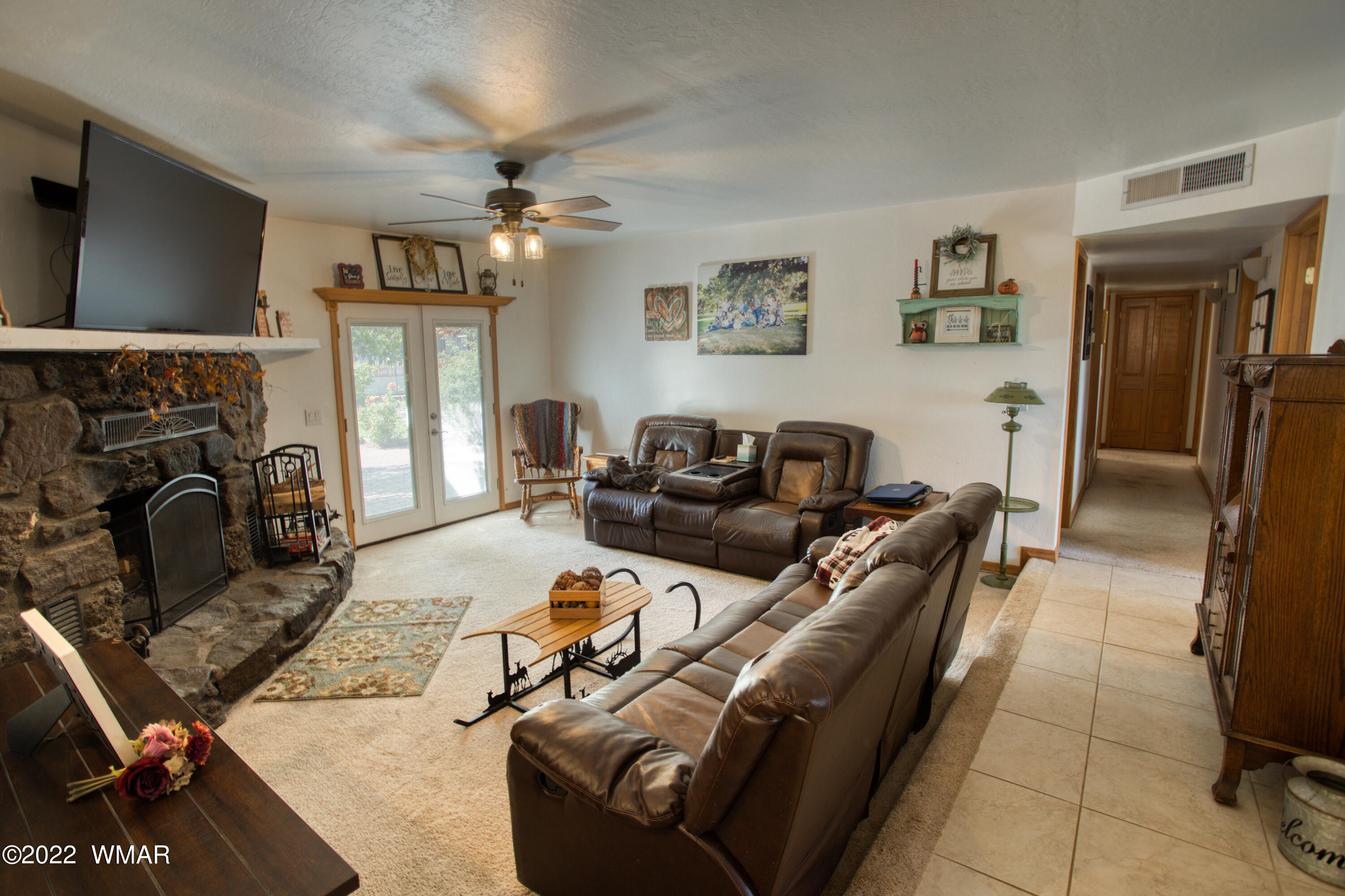 501 West 7th S Street Snowflake, AZ 85937 - Photo 4 of 33 a living room with furniture and a flat screen tv