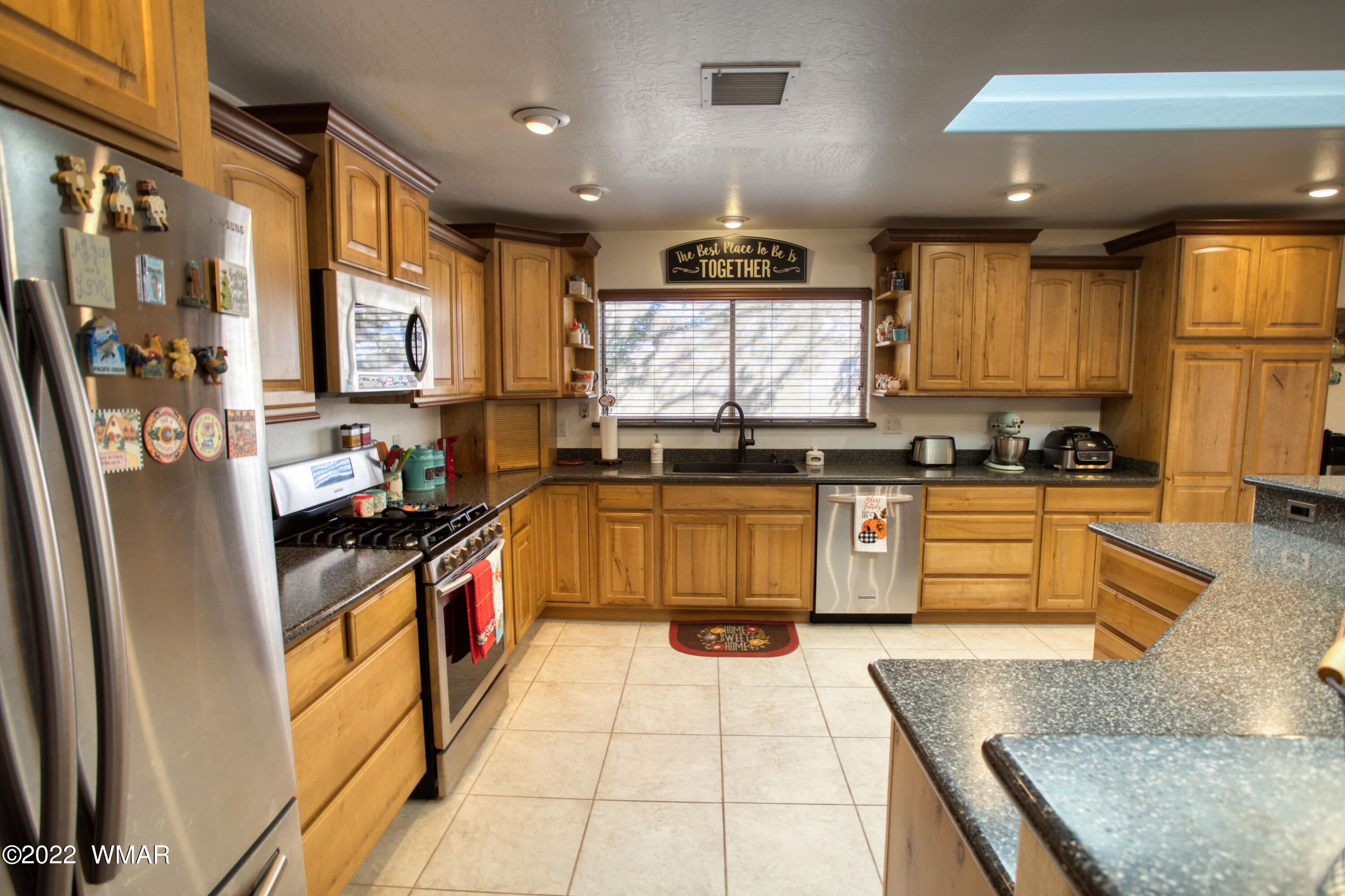 501 West 7th S Street Snowflake, AZ 85937 - Photo 5 of 33 a kitchen with stainless steel appliances granite countertop a stove a sink and a refrigerator