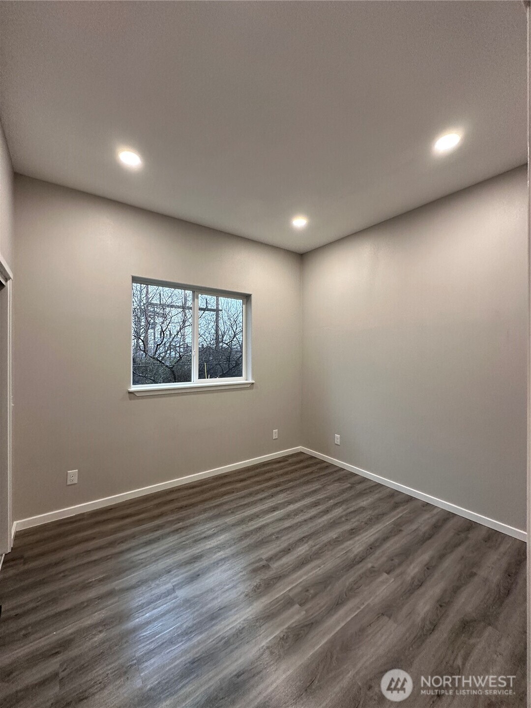 430 East Curtis Street Aberdeen, WA 98520 - Photo 17 of 30 a view of empty room with wooden floor