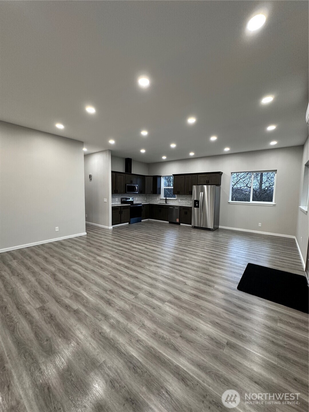 430 East Curtis Street Aberdeen, WA 98520 - Photo 8 of 30 a view of empty room with wooden floor