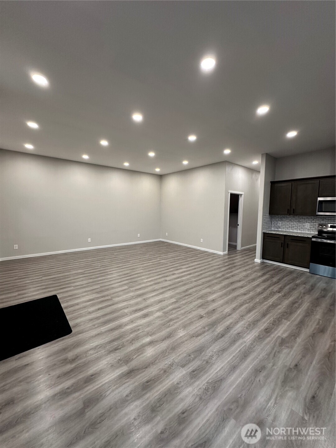 430 East Curtis Street Aberdeen, WA 98520 - Photo 9 of 30 a view of empty room with wooden floor