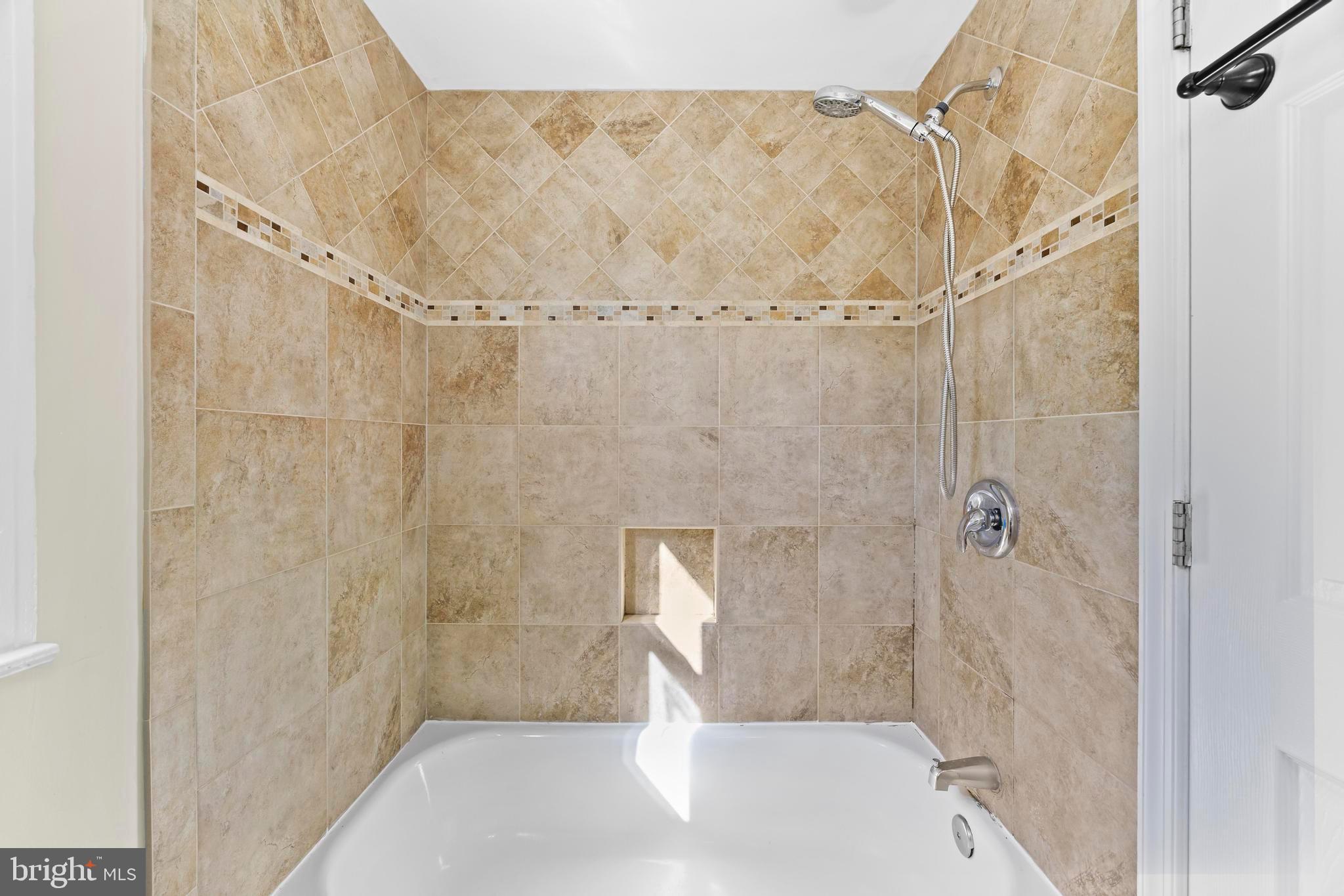 4605 Akron Street Temple Hills, MD 20748 - Photo 30 of 38 a bathroom with a shower