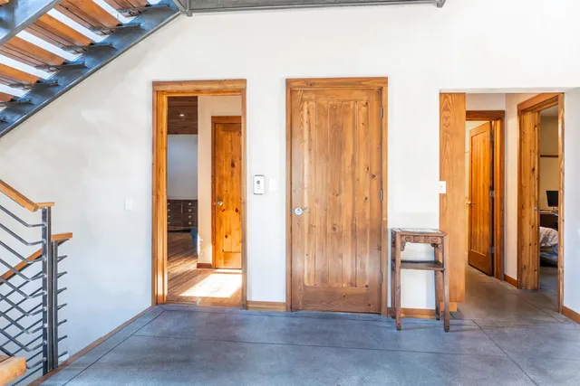 an empty room with windows and closet