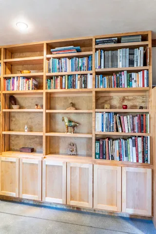 a bookshelf with wooden floor in it
