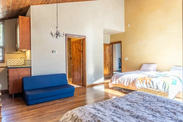 a bedroom with a bed and a couch