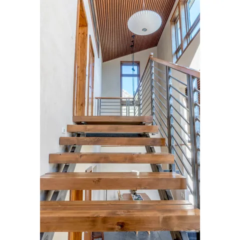 a view of staircase with white walls