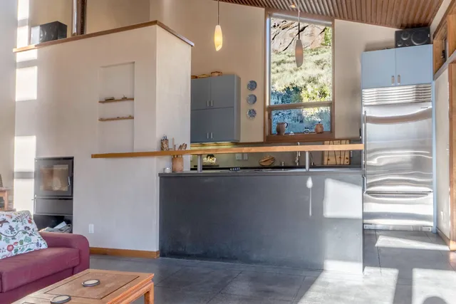 a living room with a couch and a window