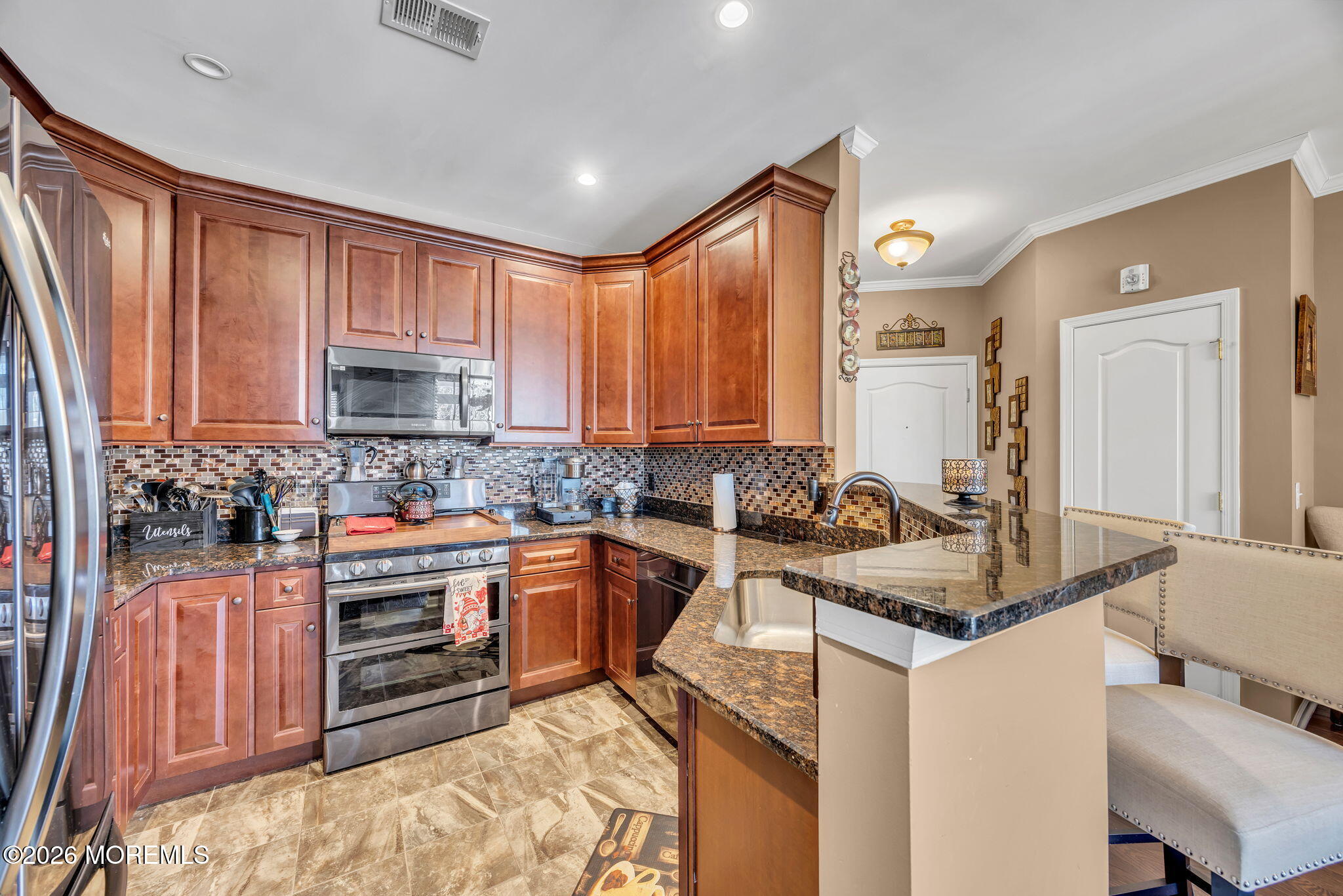 17 Stock Court, Unit 3631 Old Bridge, NJ 08857 - Photo 13 of 24 a kitchen with stainless steel appliances granite countertop a sink stove and cabinets