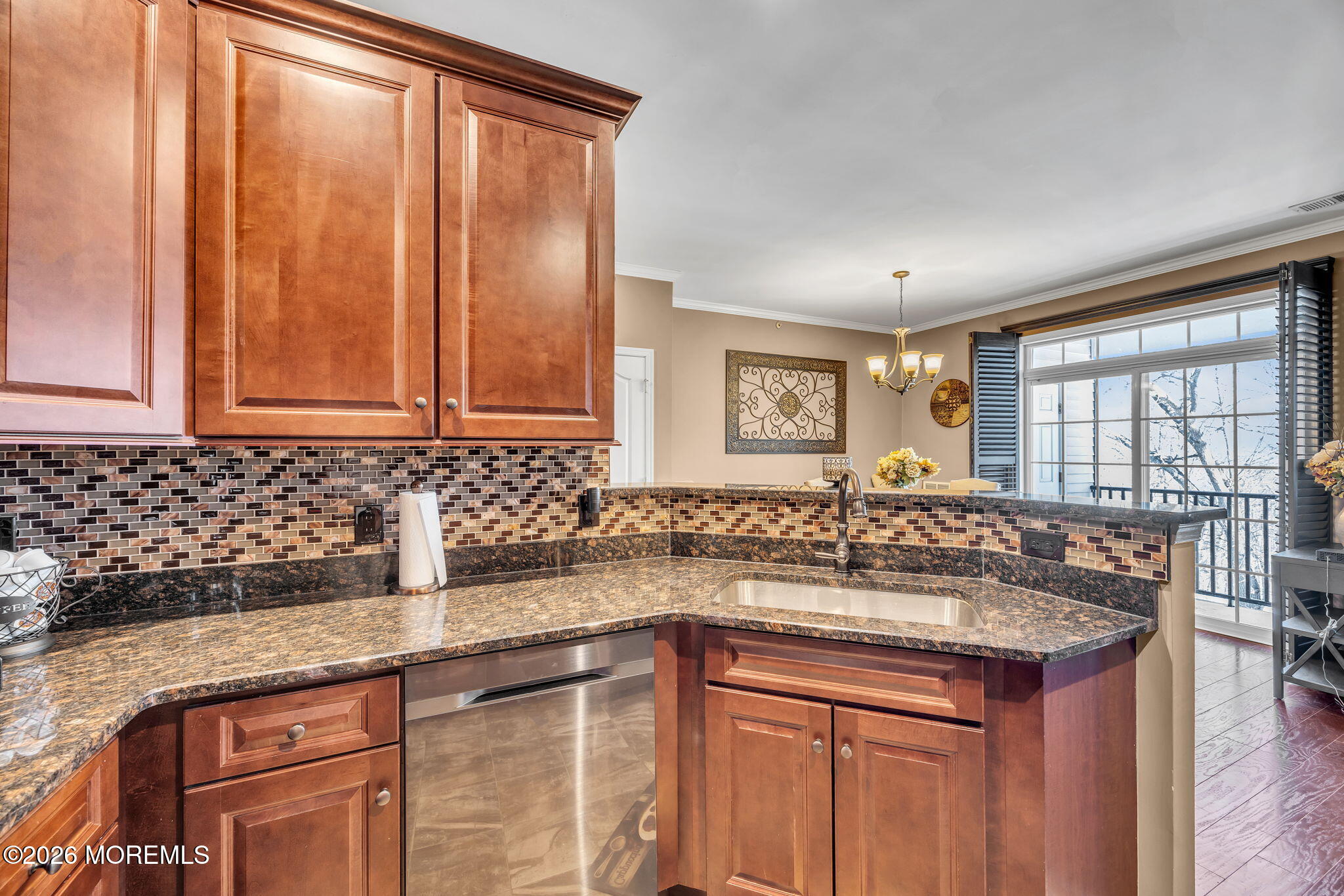 17 Stock Court, Unit 3631 Old Bridge, NJ 08857 - Photo 14 of 24 a kitchen with granite countertop a sink and a wooden cabinets