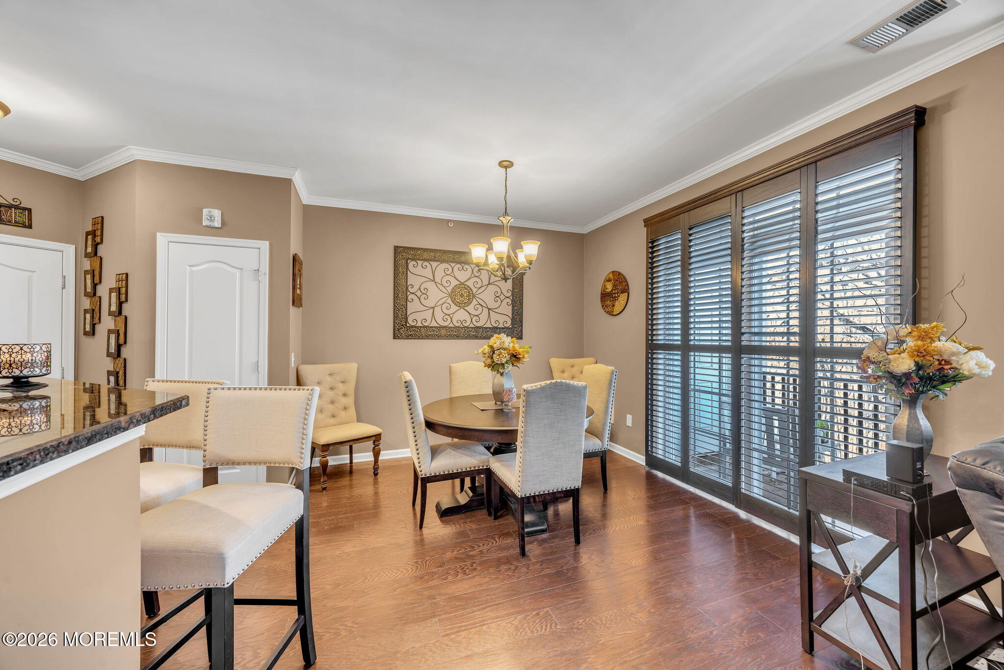 17 Stock Court, Unit 3631 Old Bridge, NJ 08857 - Photo 6 of 24 a dining room with furniture a chandelier and wooden floor