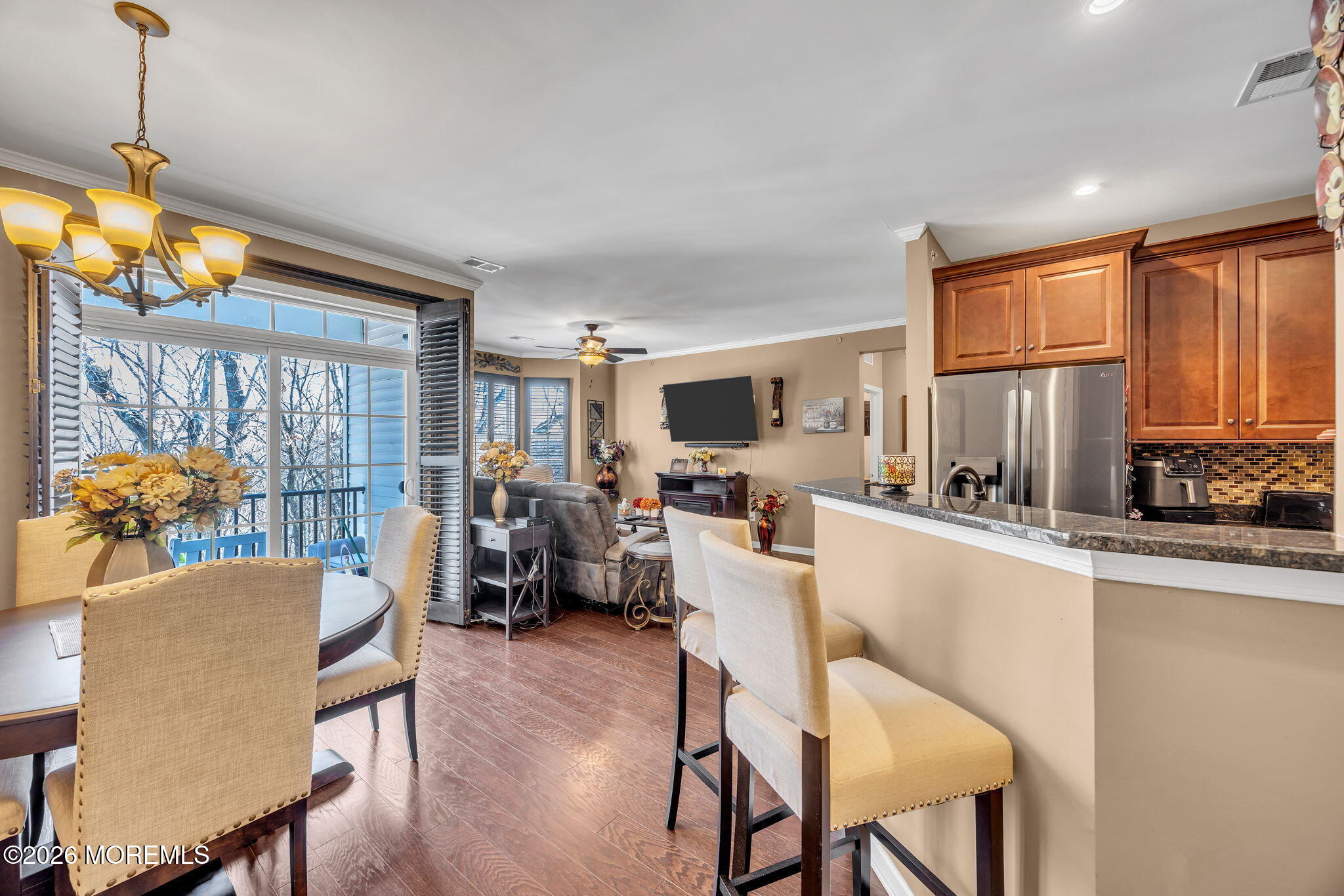 17 Stock Court, Unit 3631 Old Bridge, NJ 08857 - Photo 7 of 24 a living room with furniture a fireplace and a chandelier