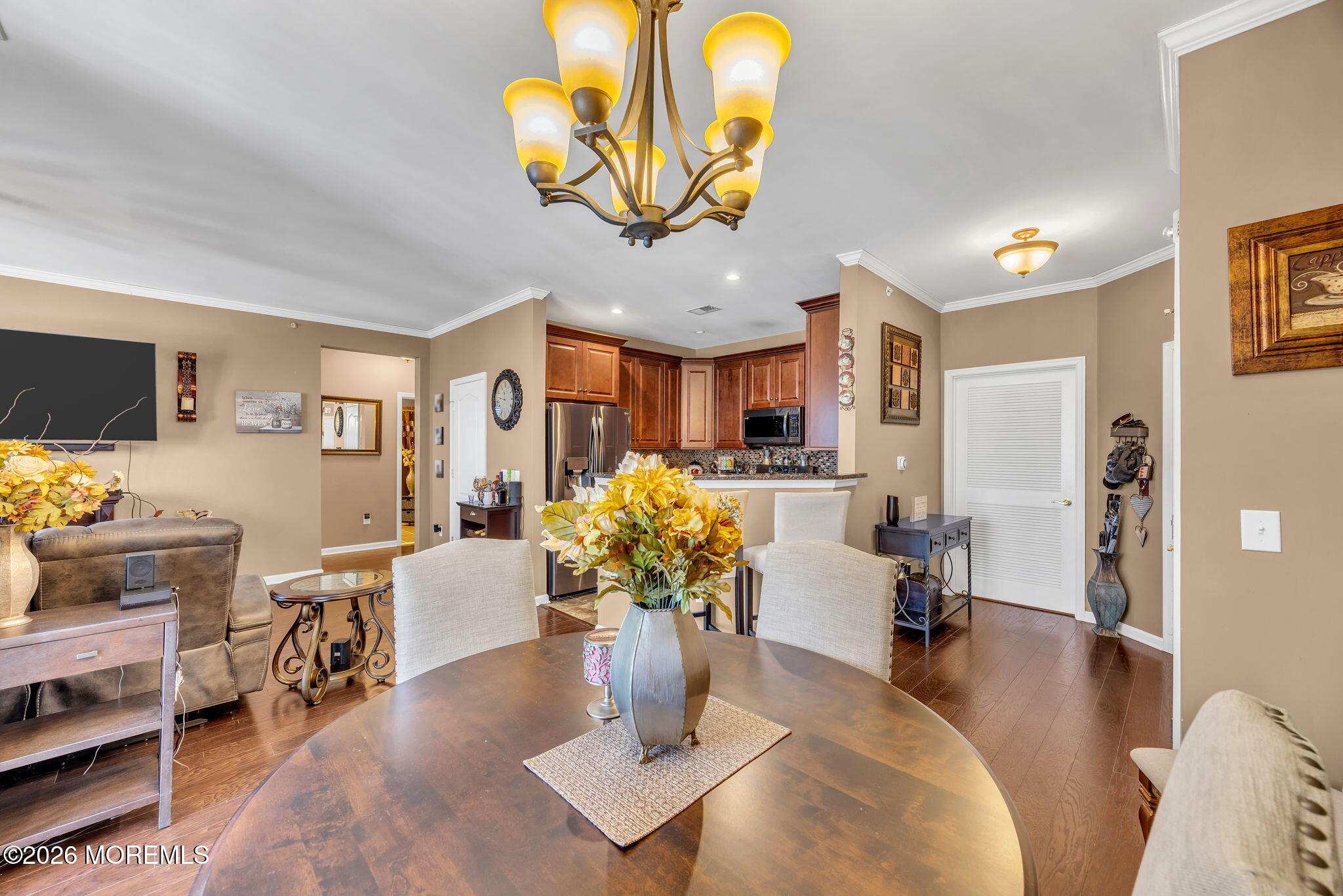 17 Stock Court, Unit 3631 Old Bridge, NJ 08857 - Photo 8 of 24 a living room with fireplace furniture and a chandelier