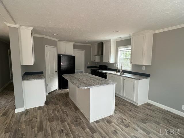 6144 Red House Road Appomattox, VA 24522 - Photo 3 of 11 a living room with stainless steel appliances kitchen island hardwood floor sink and stove