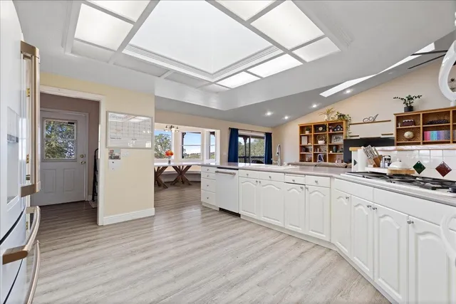 a kitchen with furniture and window