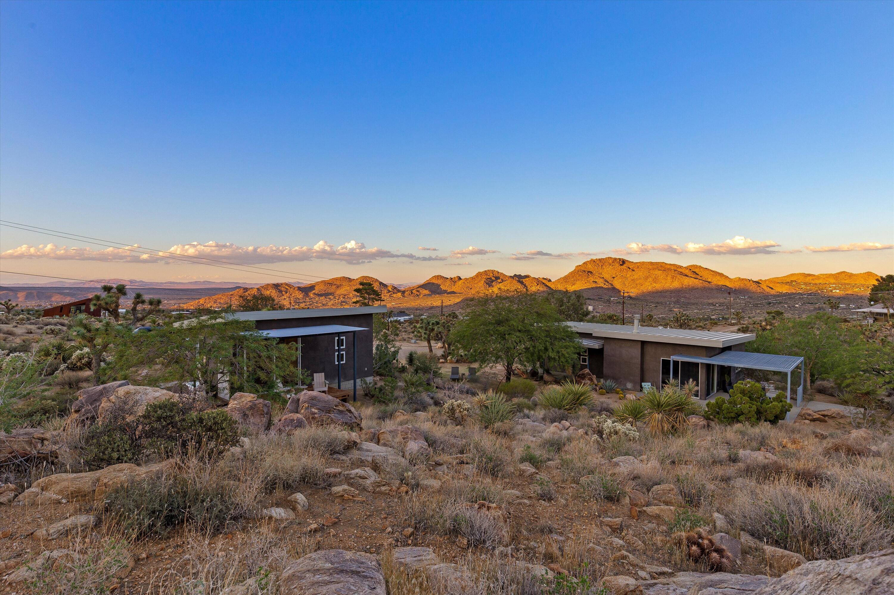 8744 Star Lane Joshua Tree, CA 92252 - Photo 2 of 55 a view of a house with a yard and balcony