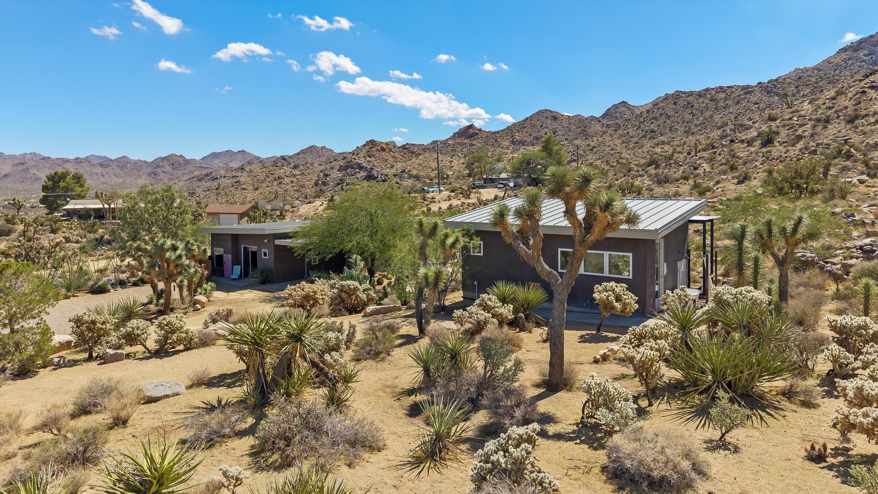 8744 Star Lane Joshua Tree, CA 92252 - Photo 27 of 55 a view of a house with a yard covered in snow