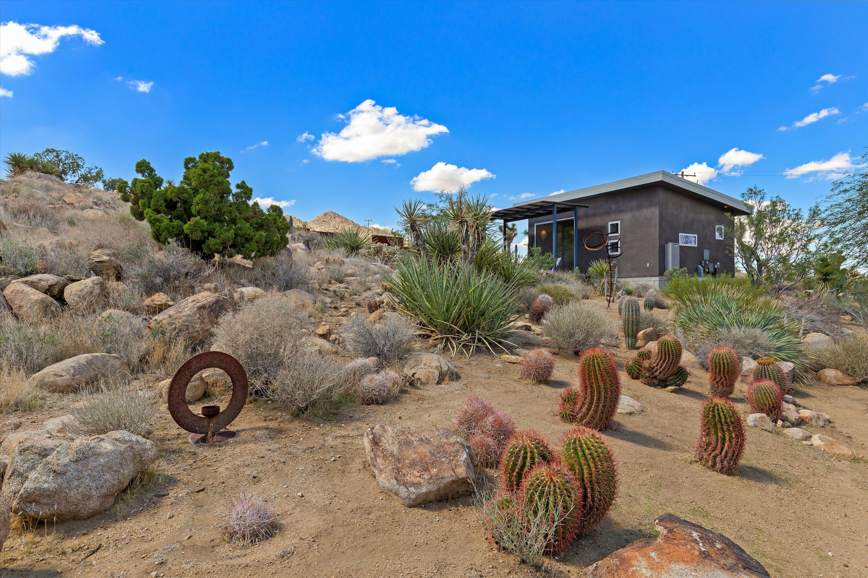 8744 Star Lane Joshua Tree, CA 92252 - Photo 33 of 55 a view of a backyard of the house
