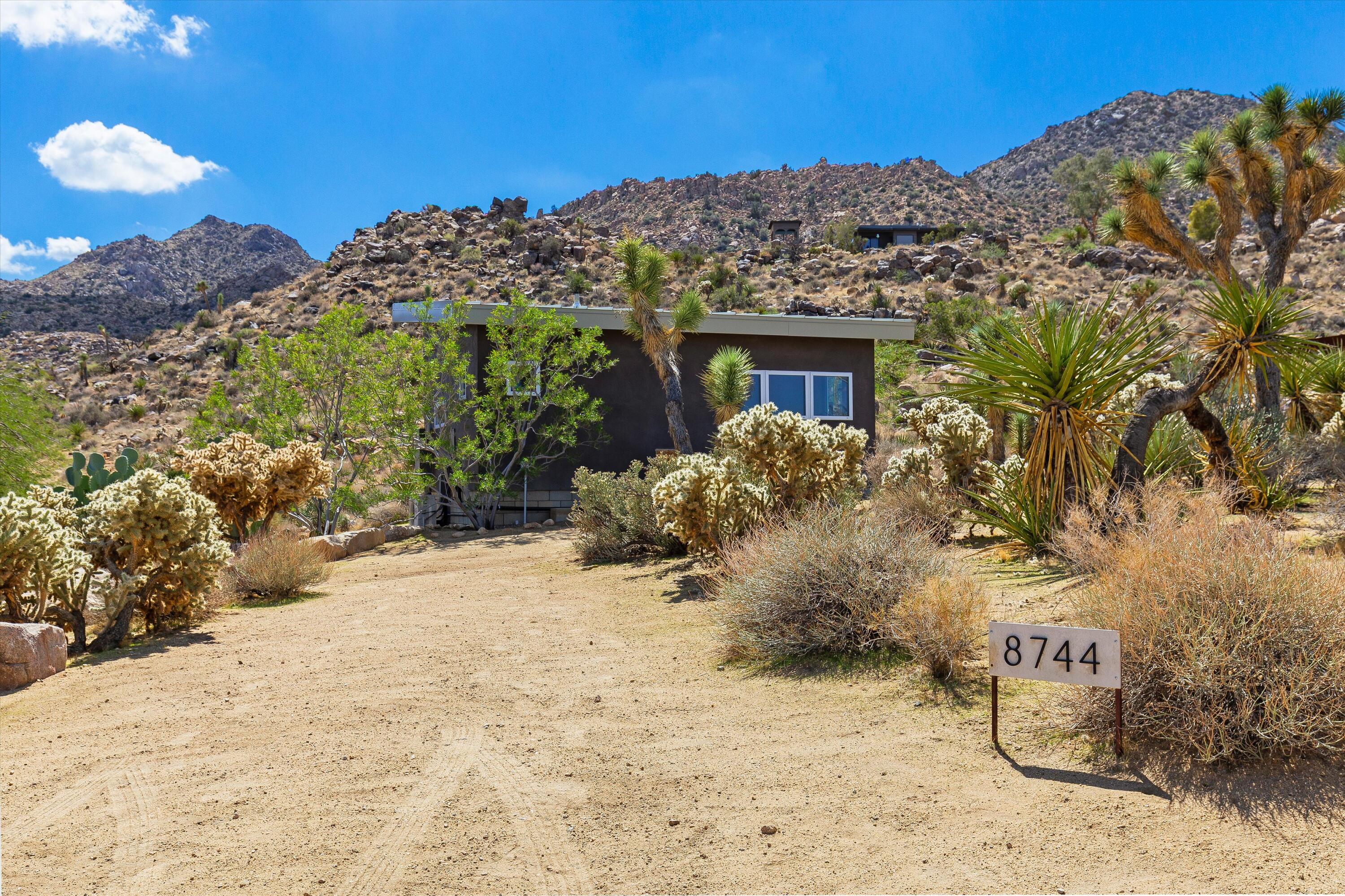 8744 Star Lane Joshua Tree, CA 92252 - Photo 34 of 55 a view of a house with a snow yard and mountain view