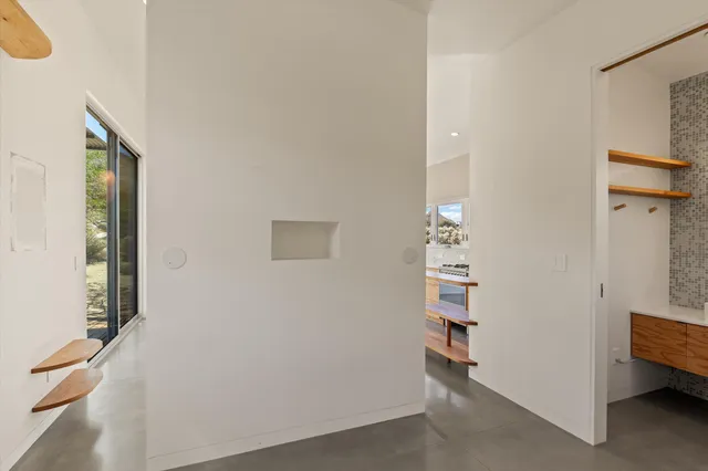 a view of room with hallway and closet