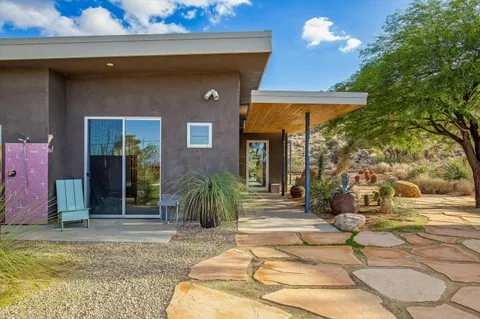 a view of a wooden door and an outdoor space