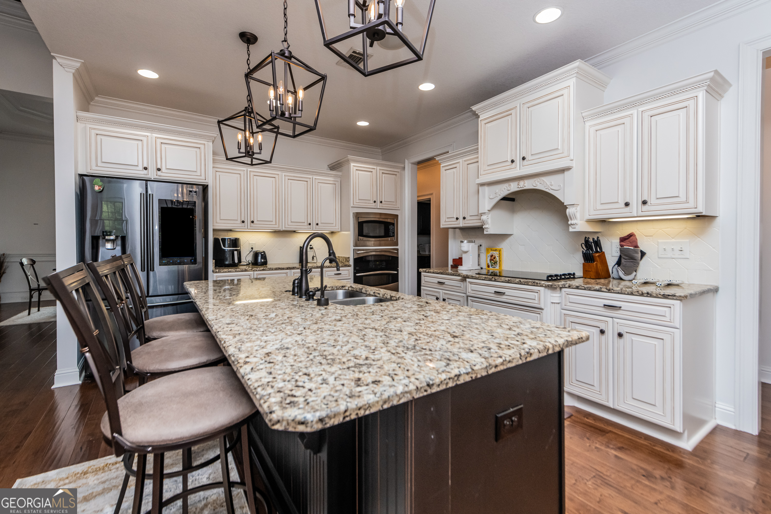 405 Old Bridge Road Warner Robins, GA 31088 - Photo 16 of 55 a kitchen with stainless steel appliances granite countertop a sink a stove and a wooden cabinets