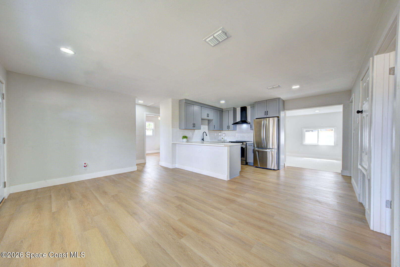 1029 Illinois Road Cocoa, FL 32927 - Photo 4 of 23 living room open to kitchen (9)