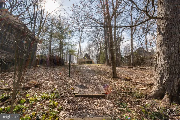 a view of a swimming pool with an outdoor space and seating area