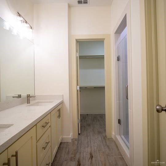 3052 Briggs Road, Unit C Weslaco, TX 78596 - Photo 9 of 16 Bathroom featuring a dual vanity with light countertops and undermount sinks