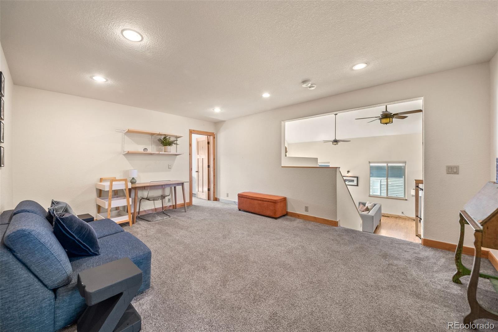 7102 Lynx Lair Road Evergreen, CO 80439 - Photo 14 of 42 a living room with furniture