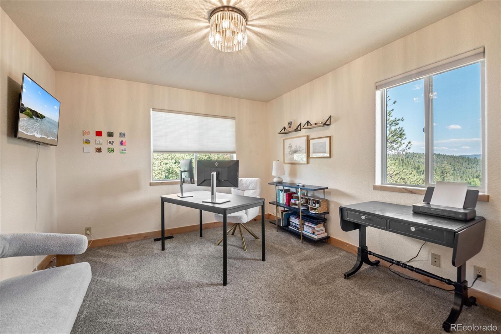 7102 Lynx Lair Road Evergreen, CO 80439 - Photo 24 of 42 a living room with furniture and a window