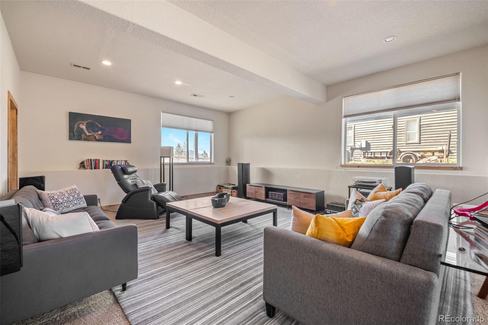 7102 Lynx Lair Road Evergreen, CO 80439 - Photo 26 of 42 a living room with furniture and a window