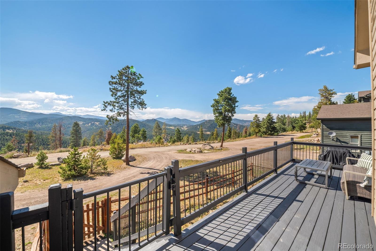 7102 Lynx Lair Road Evergreen, CO 80439 - Photo 31 of 42 a view of city from balcony