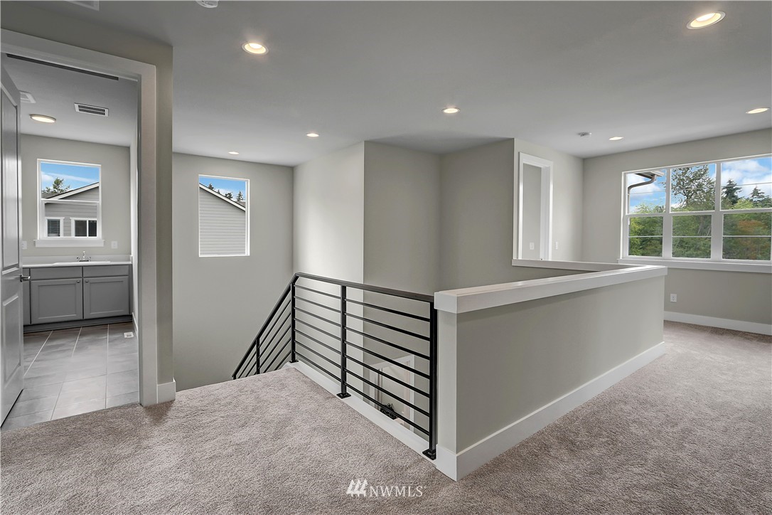 322 Field Place Southeast Renton, WA 98059 - Photo 15 of 25 wooden floor in an empty room with a window