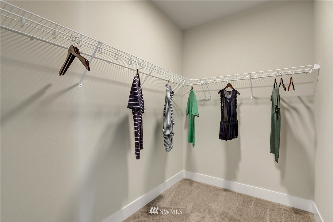 322 Field Place Southeast Renton, WA 98059 - Photo 19 of 25 a view of walk in closet with clothes and shoes
