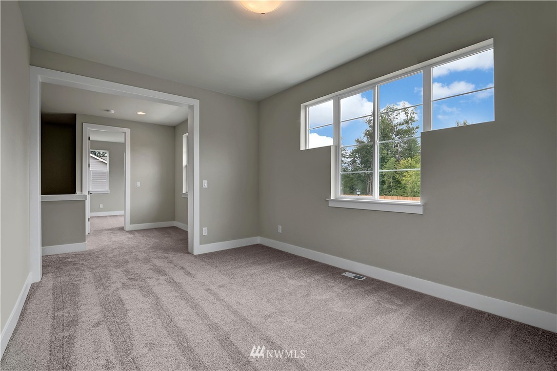 322 Field Place Southeast Renton, WA 98059 - Photo 21 of 25 an empty room with windows and closet