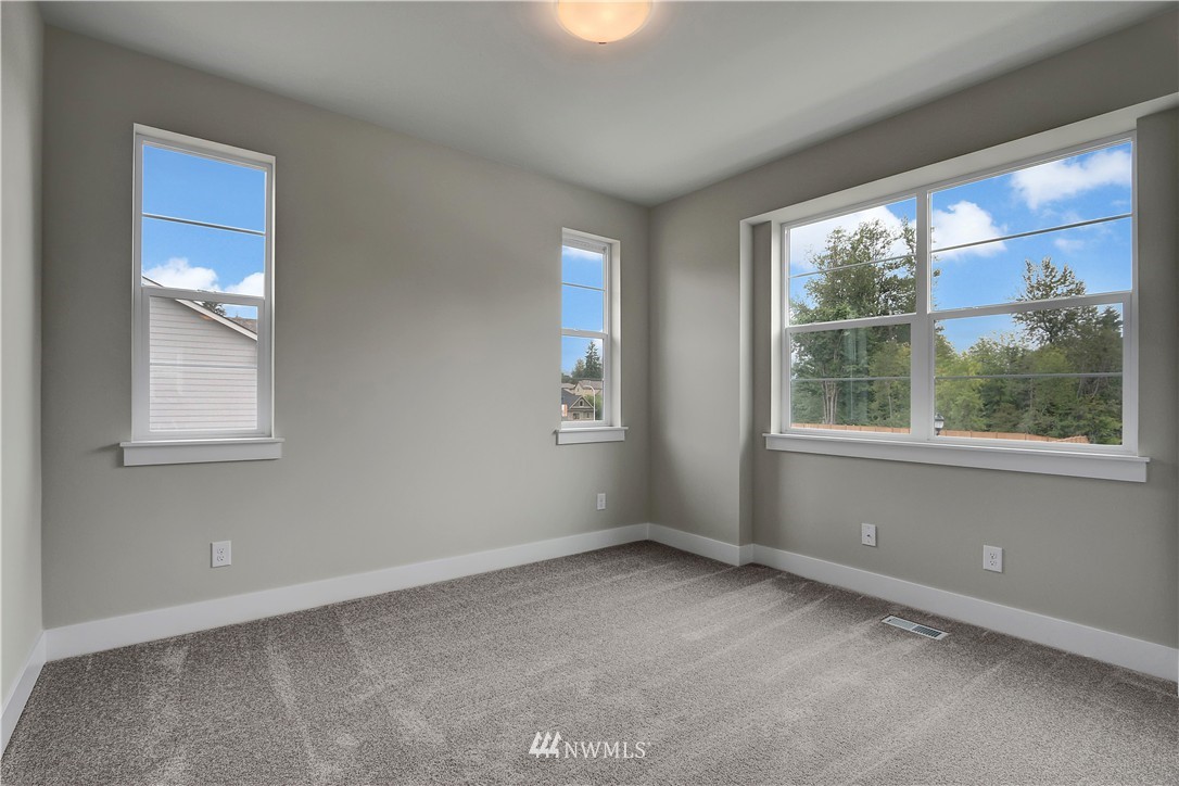 322 Field Place Southeast Renton, WA 98059 - Photo 22 of 25 an empty room with a window