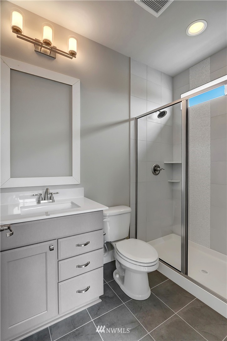 322 Field Place Southeast Renton, WA 98059 - Photo 23 of 25 a bathroom with a sink a toilet and shower