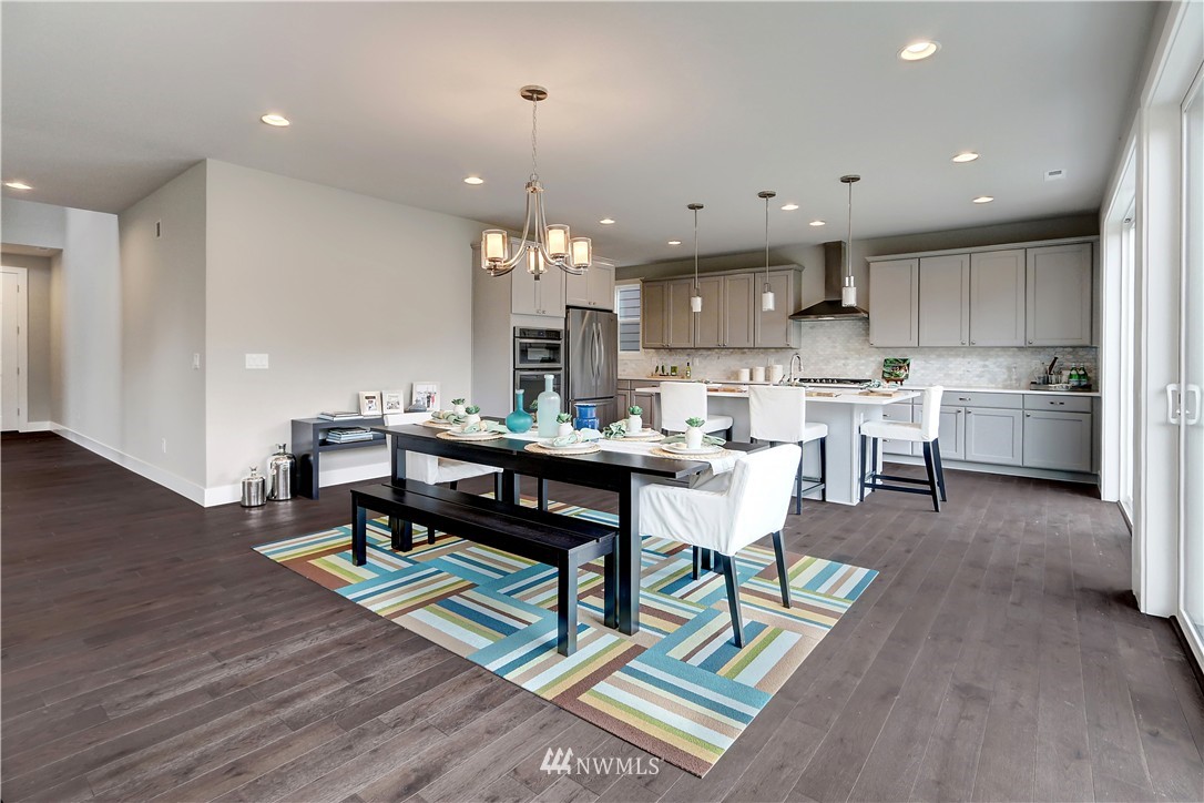 322 Field Place Southeast Renton, WA 98059 - Photo 5 of 25 a kitchen with a dining table chairs and kitchen view