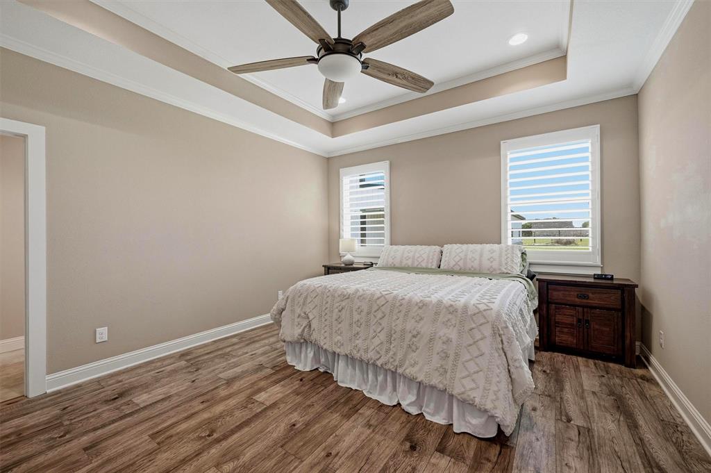 662 Preakness Place Road Van Alstyne, TX 75495 - Photo 12 of 39 a bedroom with a bed and a ceiling fan