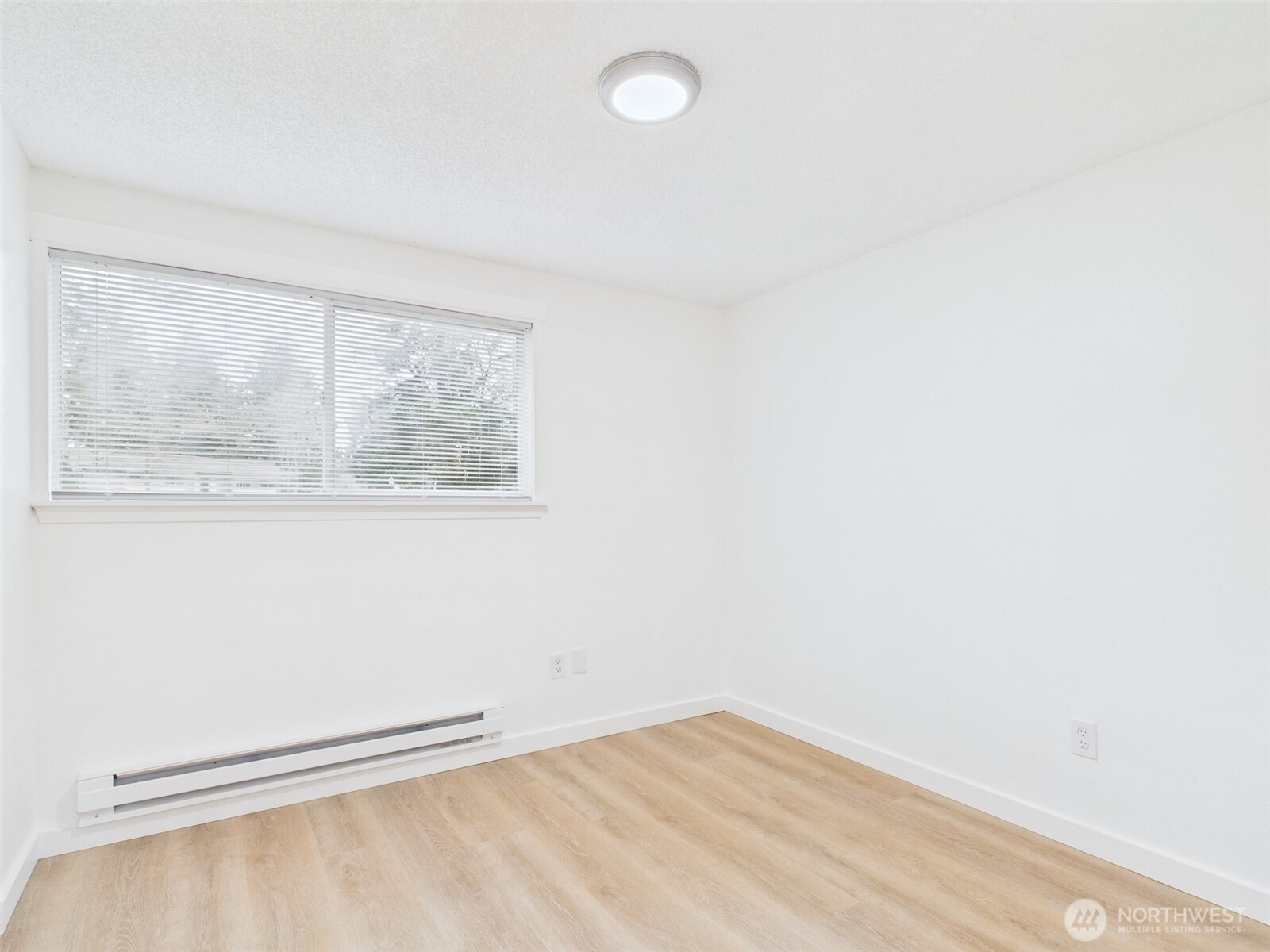 32142 46th Place Southwest, Unit M6 Federal Way, WA 98023 - Photo 13 of 29 a view of a small space with wooden floor and a window