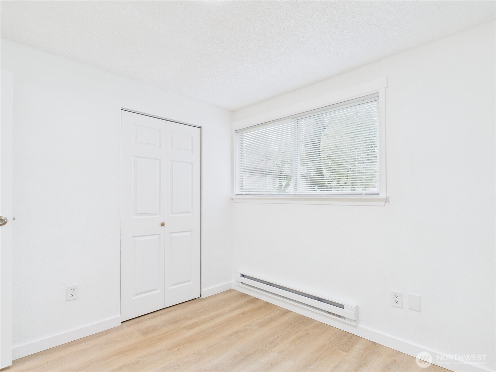 32142 46th Place Southwest, Unit M6 Federal Way, WA 98023 - Photo 14 of 29 an empty room with wooden floor and windows