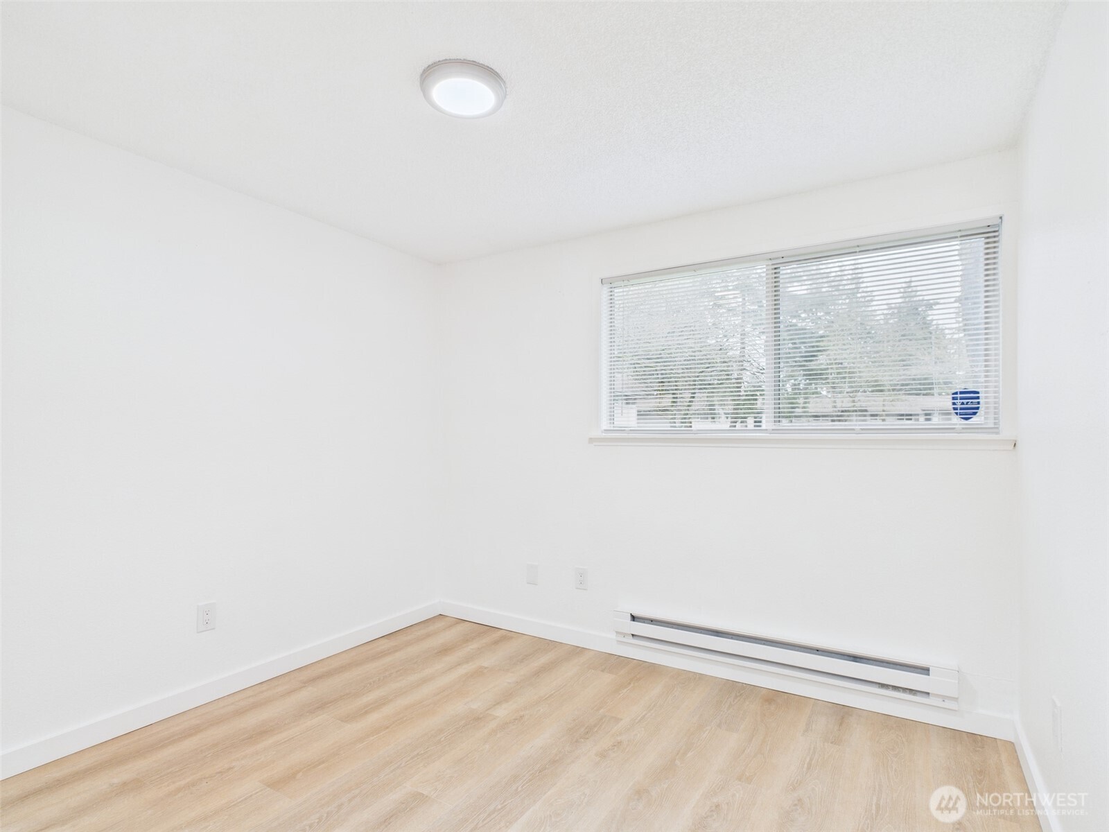32142 46th Place Southwest, Unit M6 Federal Way, WA 98023 - Photo 15 of 29 a view of empty room with wooden floor and fan