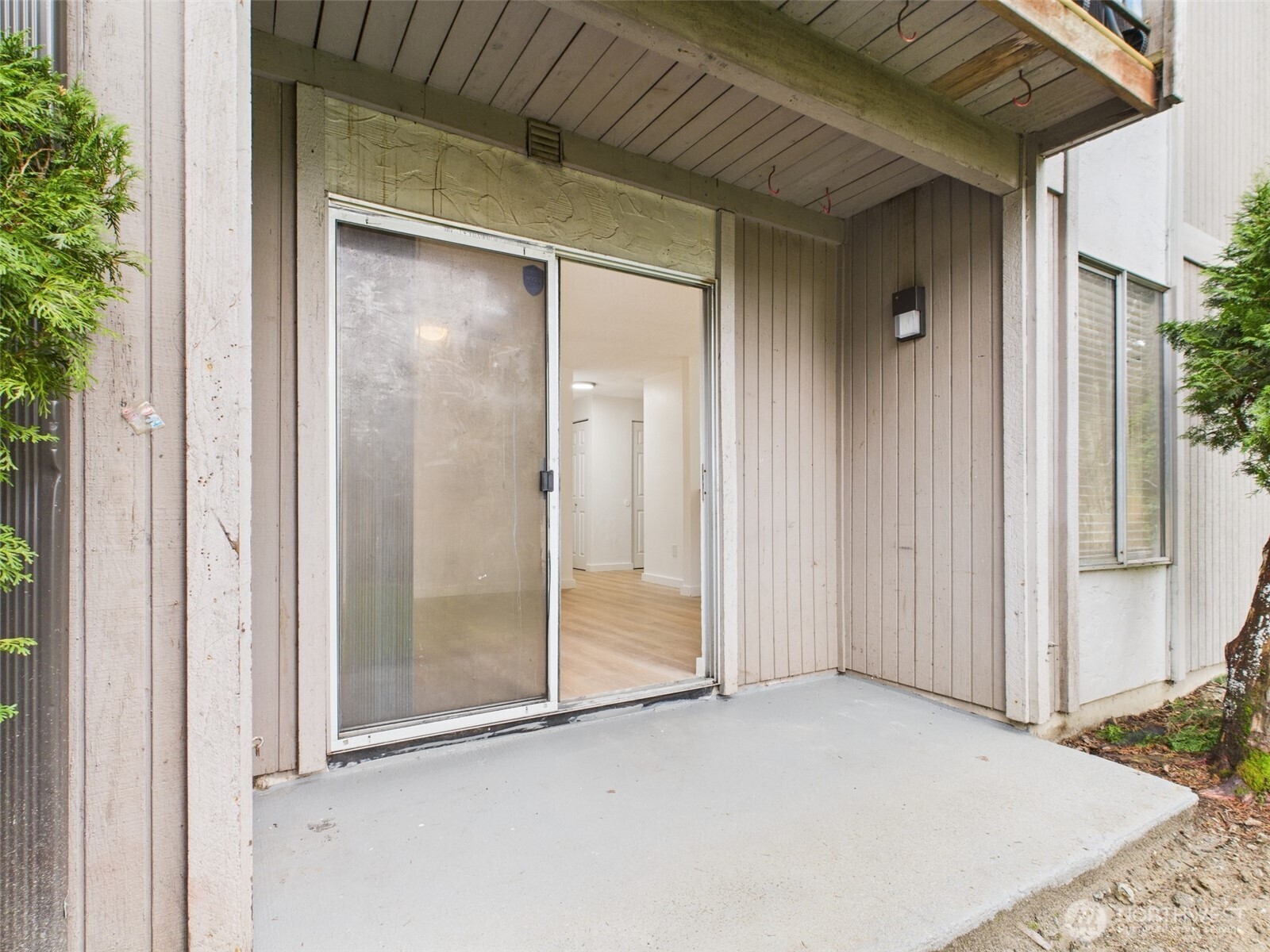 32142 46th Place Southwest, Unit M6 Federal Way, WA 98023 - Photo 22 of 29 a view of backyard with sliding door and wooden door