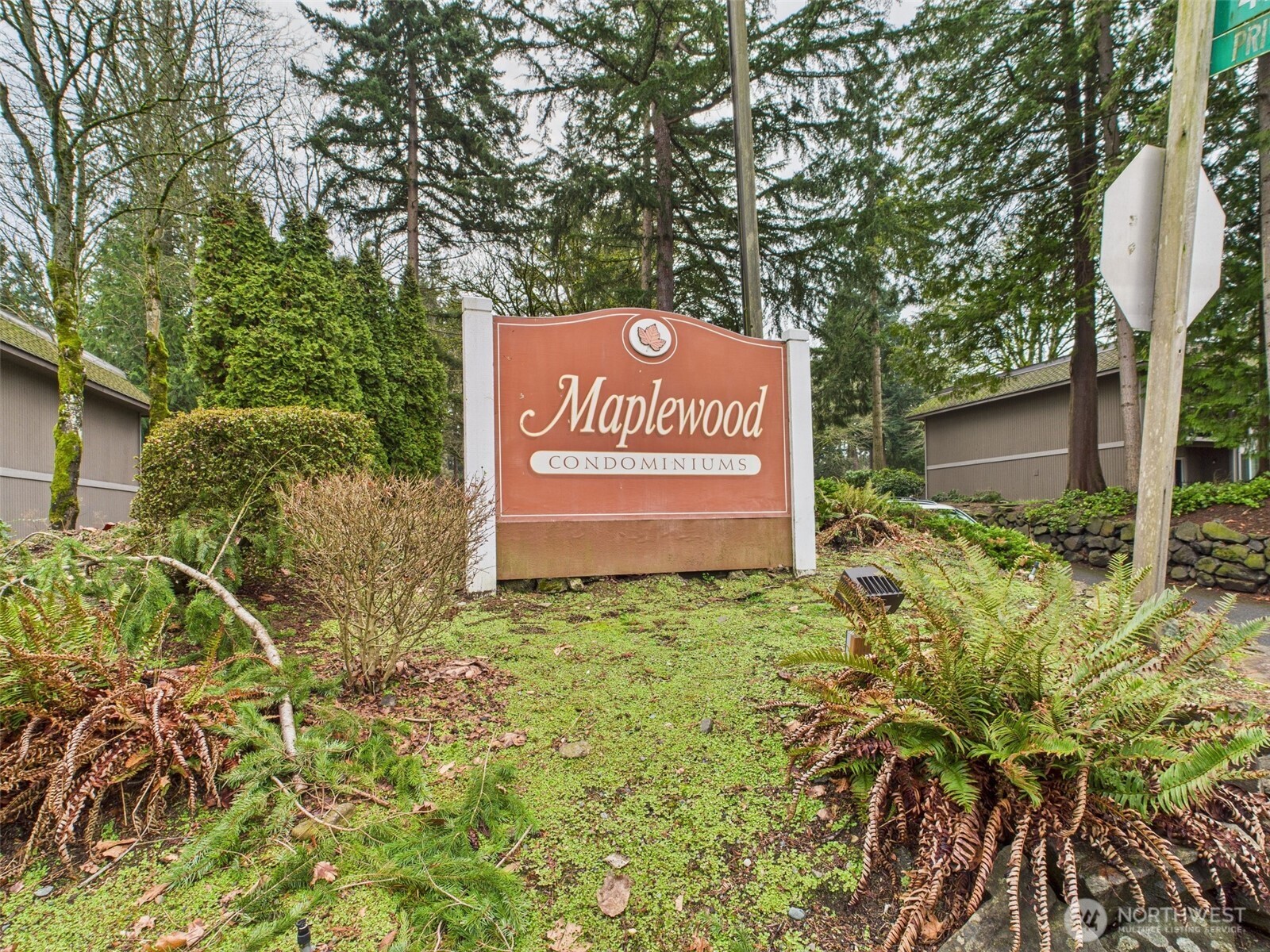 32142 46th Place Southwest, Unit M6 Federal Way, WA 98023 - Photo 29 of 29 a sign that is sitting in front of a tree