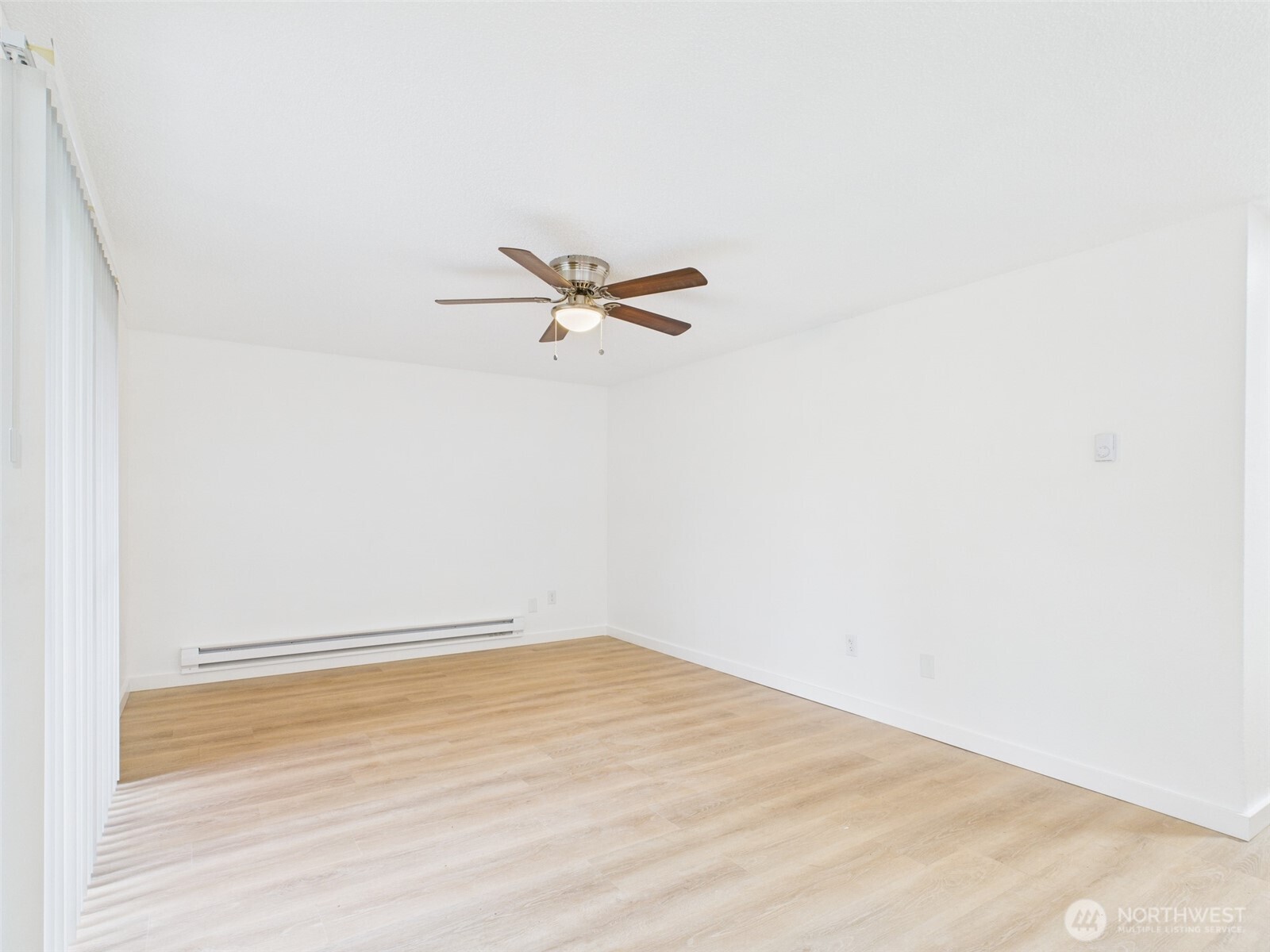 32142 46th Place Southwest, Unit M6 Federal Way, WA 98023 - Photo 5 of 29 a view of a room with wooden floor