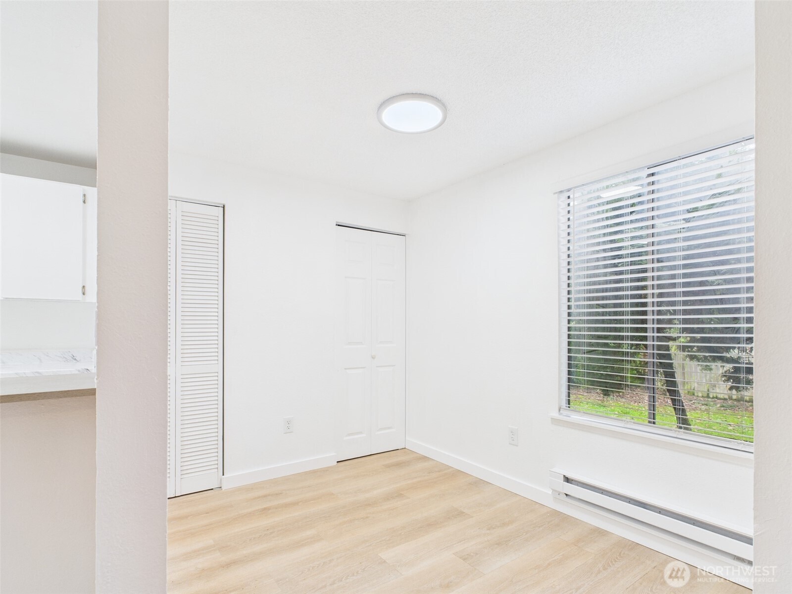 32142 46th Place Southwest, Unit M6 Federal Way, WA 98023 - Photo 6 of 29 a view of a room that has a window in it